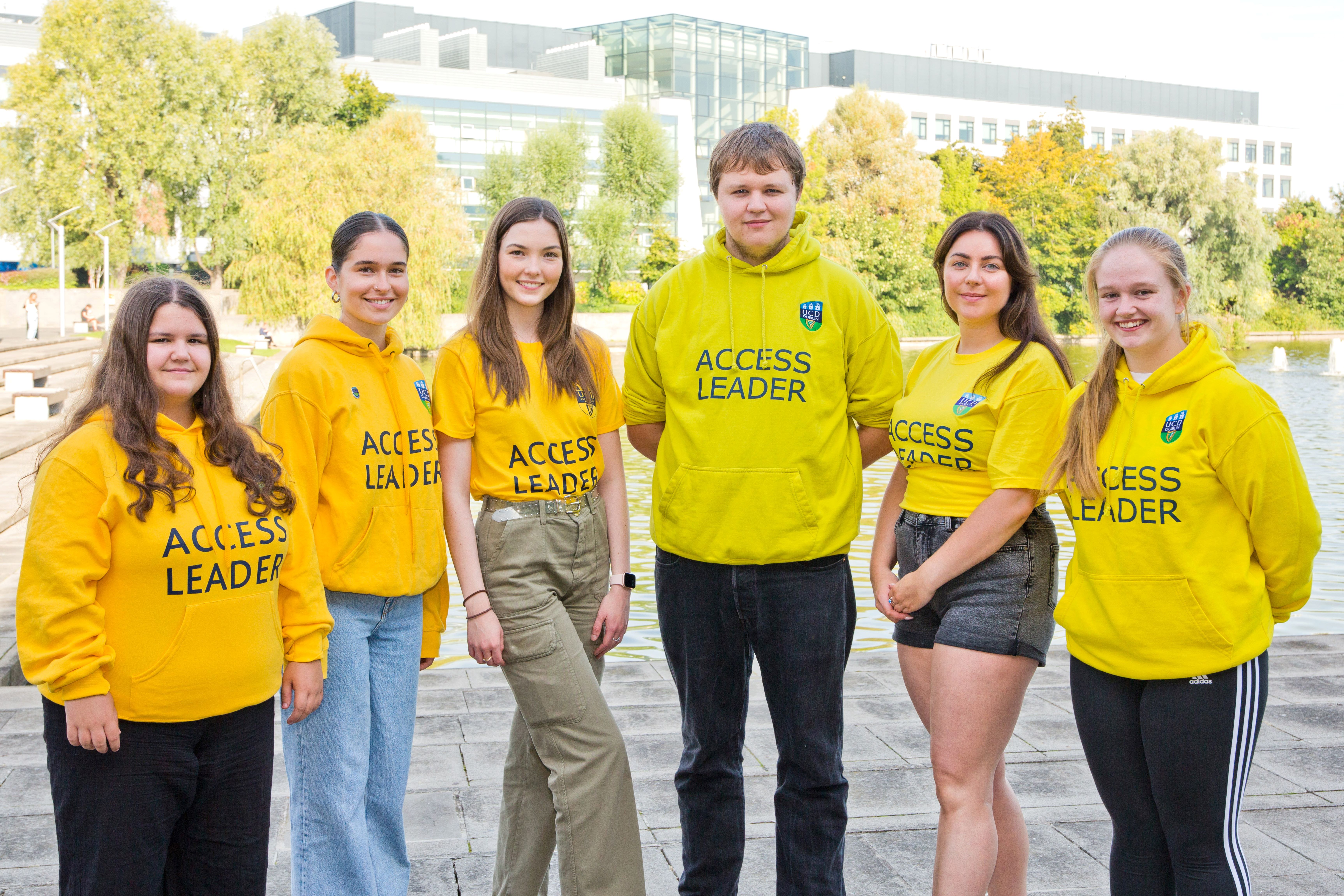 six ucd access leaders wearing yellow jumpers at the UCD lake